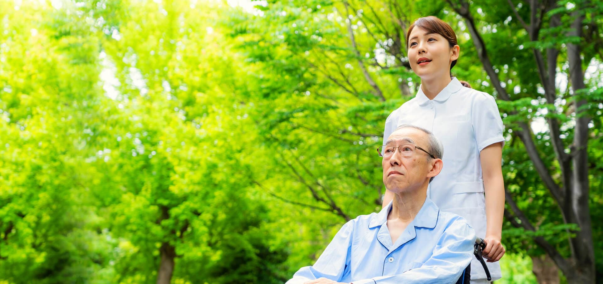 caregiver with elder man on a wheelchair