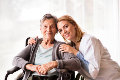 an old lady and a woman smiling