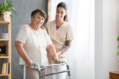 a nurse smiling at an elderly