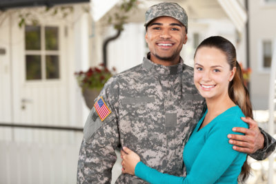 a woman and a soldier smiling