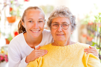 a nurse and an old lady smiling