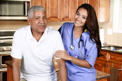 a nurse helping an elderly