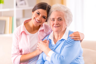 a nurse and an old lady smiling