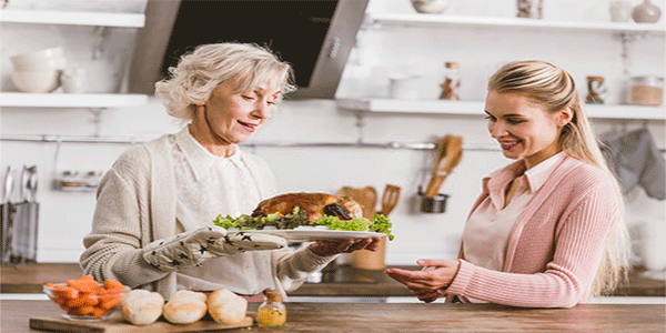 a woman and an elderly cooking