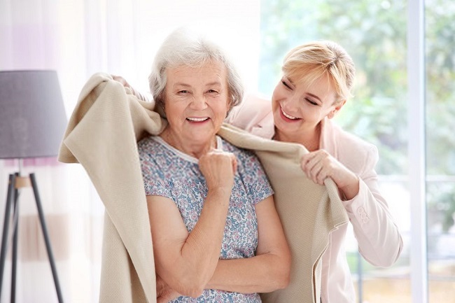 an elderly an a woman smiling