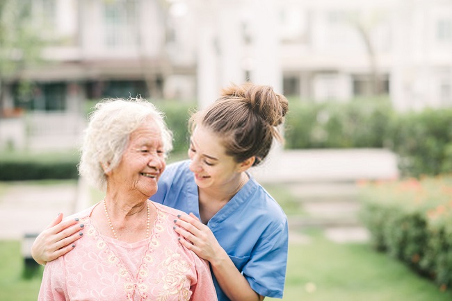 a woman and an elderly smiling