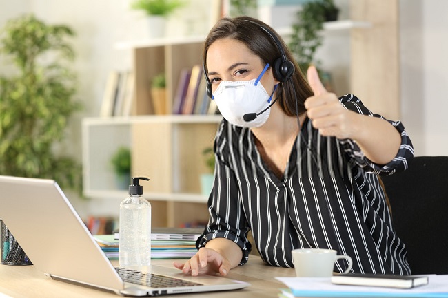 a woman with a headset wearing a face mask