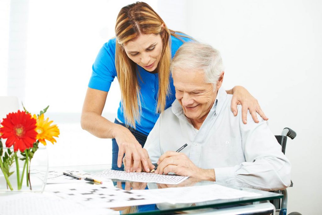 an elderly answering a puzzle