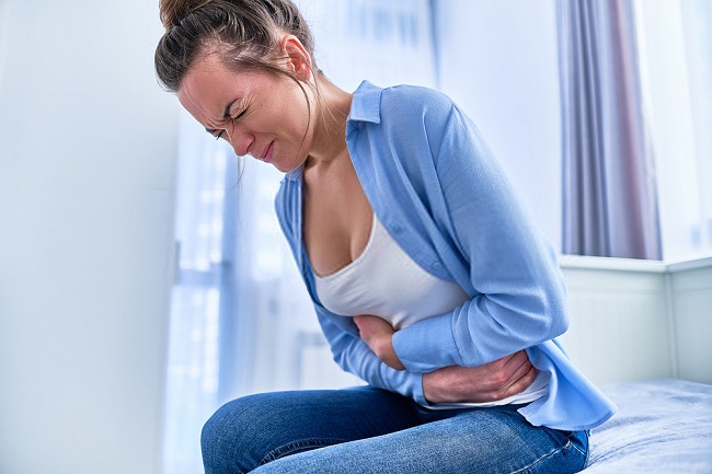 a woman with a stomach pain