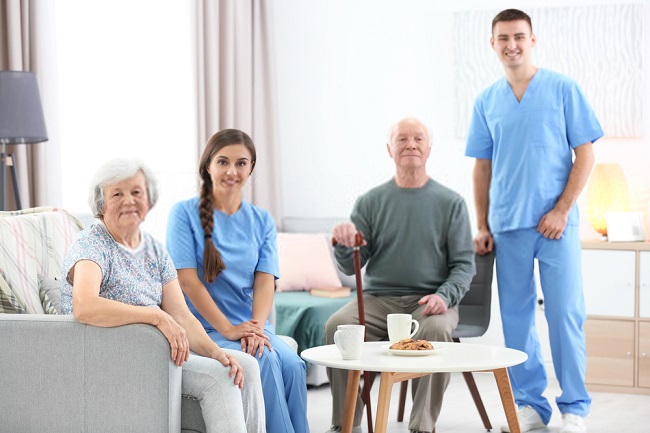 four people smiling