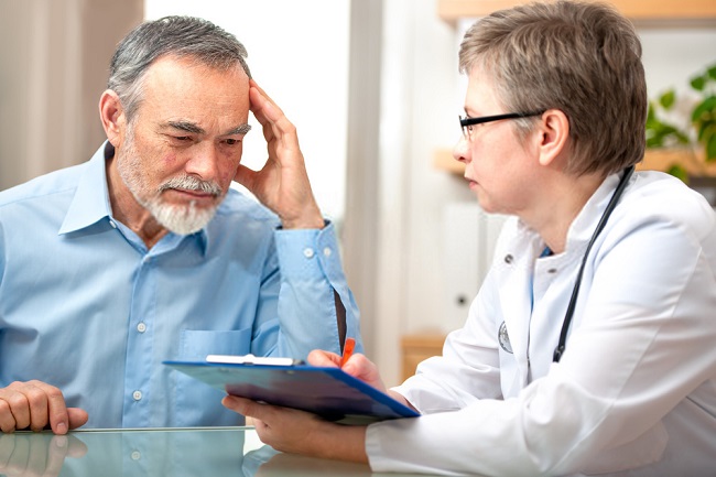 a doctor showing an elderly his diagnosis