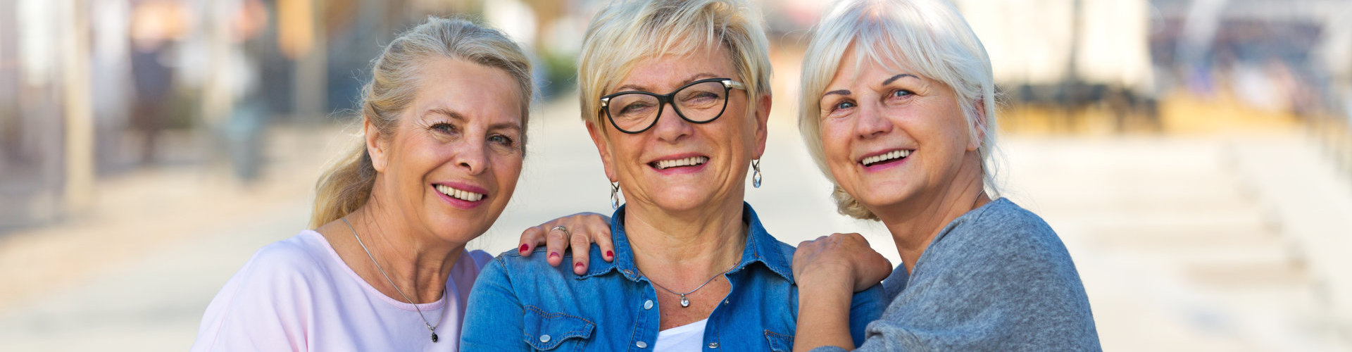 three seniors smiling