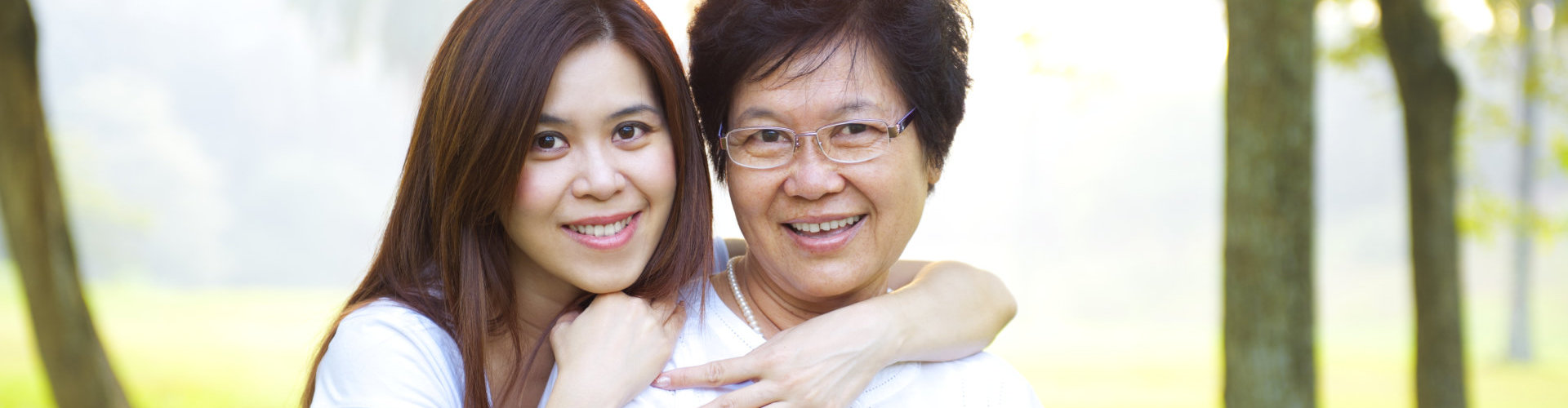 a woman and an elderly smiling