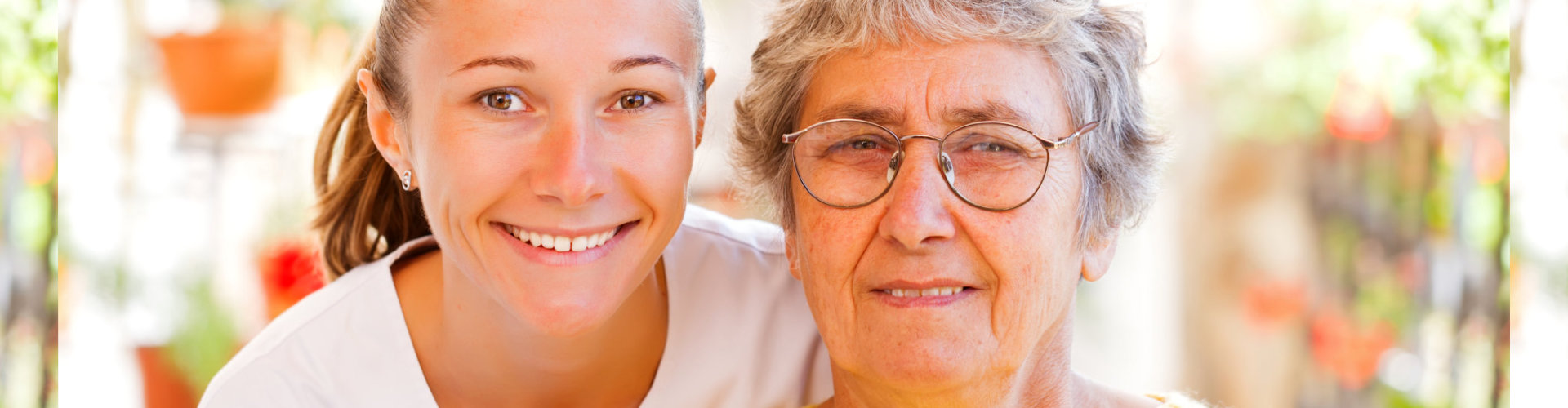 a nurse and an old lady smiling