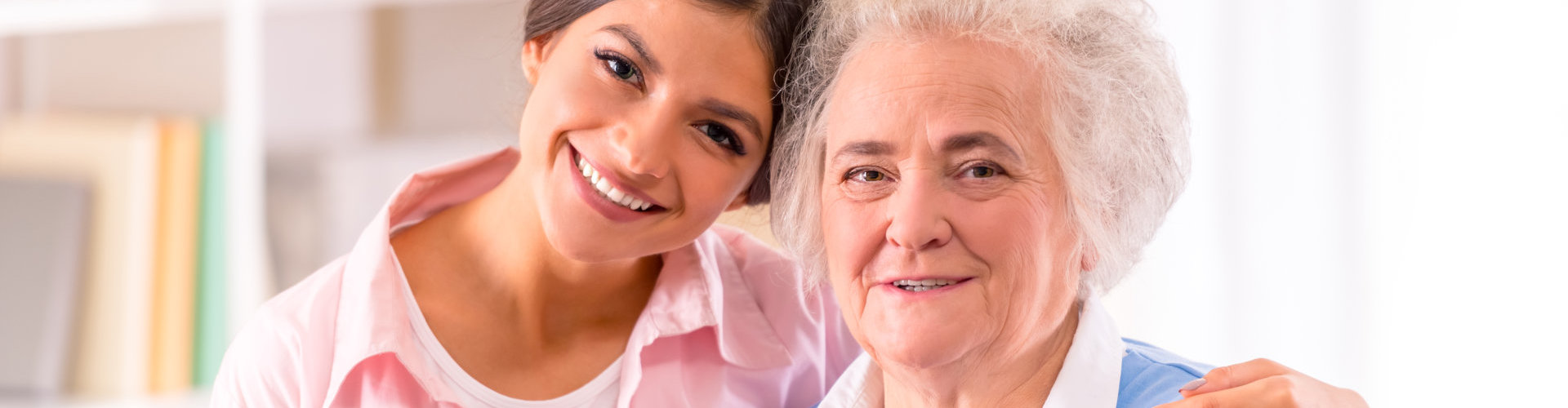 a nurse and an old lady smiling