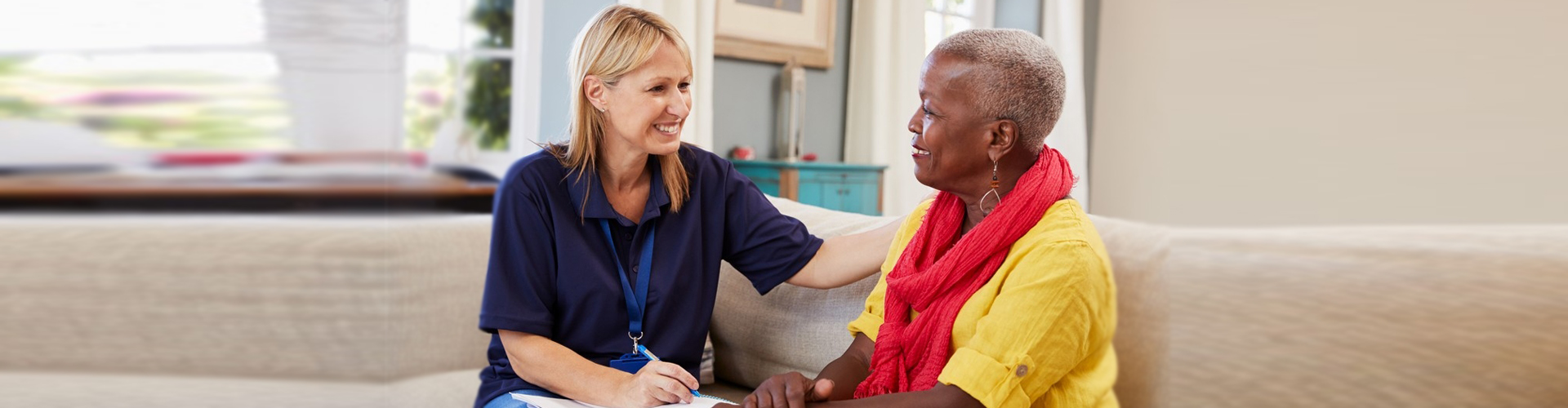 caregiver and elder woman talking