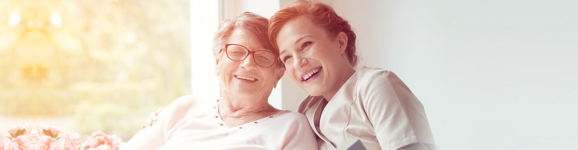 an elderly and a woman smiling