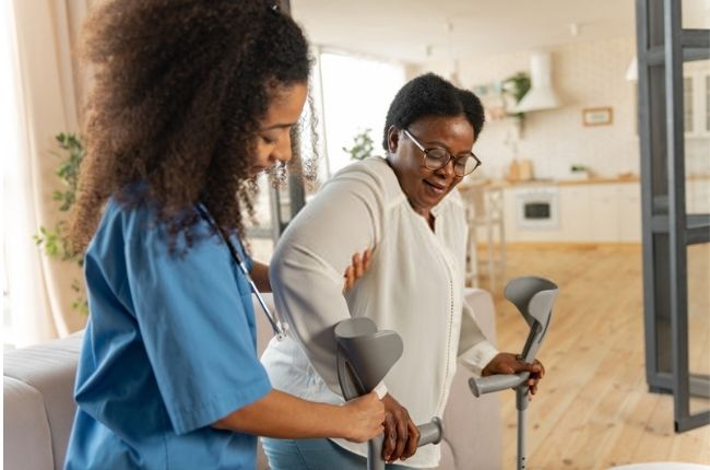 a woman being helped by a nurse