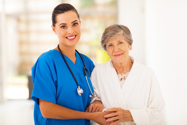 a nurse and an elderly smiling